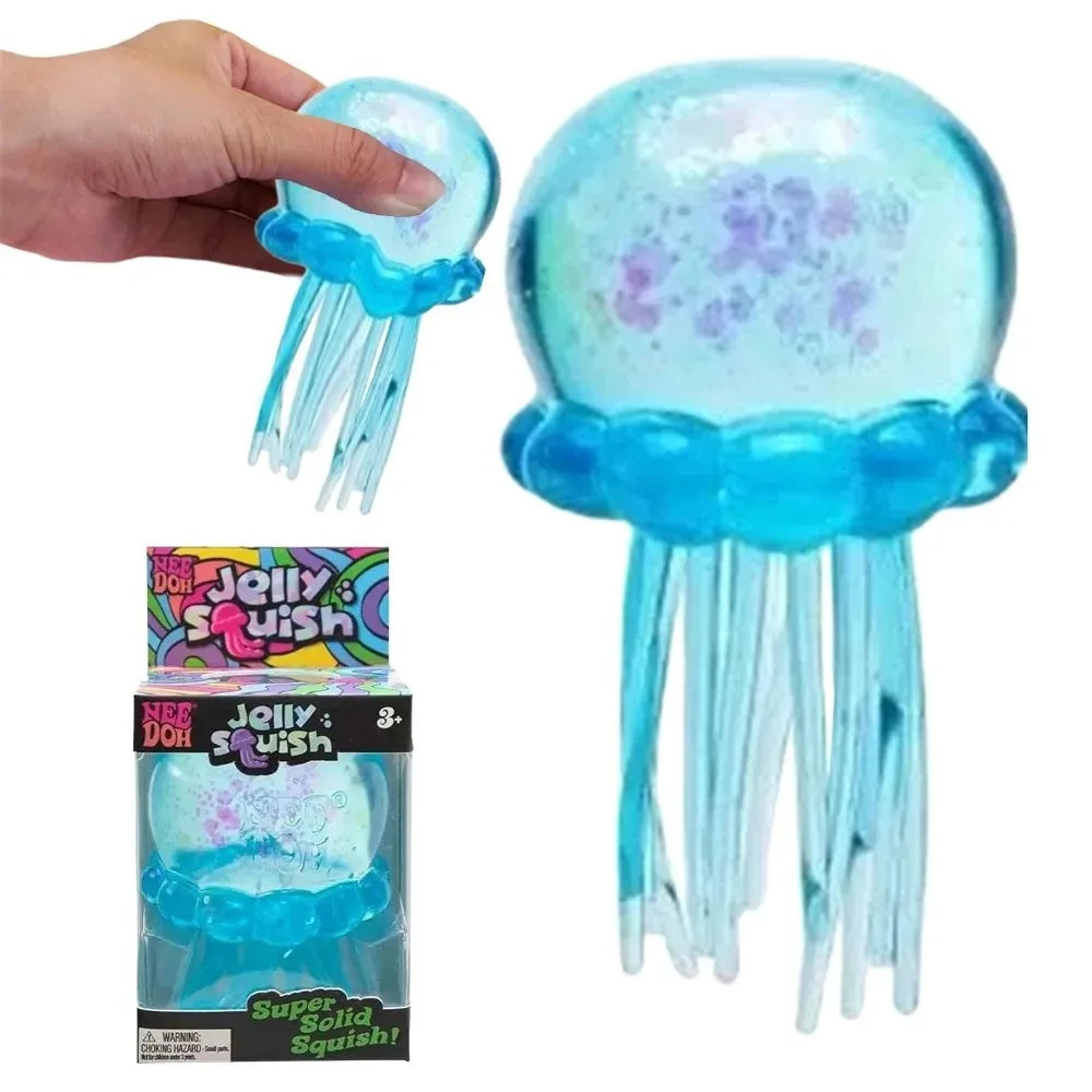 Squishy meduza – meduza u ruci uz kutiju